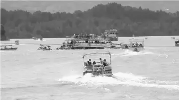  ??  ?? The tourist boat sinks in the Guatape reservoir in this still image taken from video obtained from social media. — Reuters photo