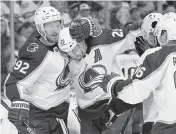  ?? MARK ZALESKI AP ?? Avalanche center Nathan MacKinnon (29) celebrates with left wing Gabriel Landeskog (92) after MacKinnon scored.