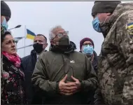  ?? (AP/Andriy Dubchak) ?? Josep Borrell, the European Union’s foreign policy chief, talks with a Ukrainian soldier Wednesday during a visit to the Stanitsa Luganskaya border crossing between Ukraine and the territory controlled by pro-Russia militants in the Luhansk region.
