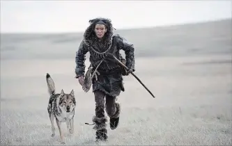  ?? ALAN MARKFIELD SOY PICTURES ENTERTAINM­ENT ?? Kodi Smit-McPhee, right, plays an young Ice Age man who befriends a wolf in "Alpha."