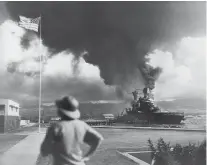  ?? PHOTO BY THE ASSOCIATED PRESS ?? In this Dec. 7, 1941, file photo, American ships burn during the Japanese attack on Pearl Harbor, Hawaii.