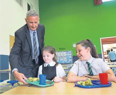  ??  ?? DUNDEE City Council launched its new school meals menu with a promise to deliver healthier options to pupils during term time.
The 2017-18 menu will see fruit juice withdrawn and desserts limited to three days to reduce sugar content.
In a move to...