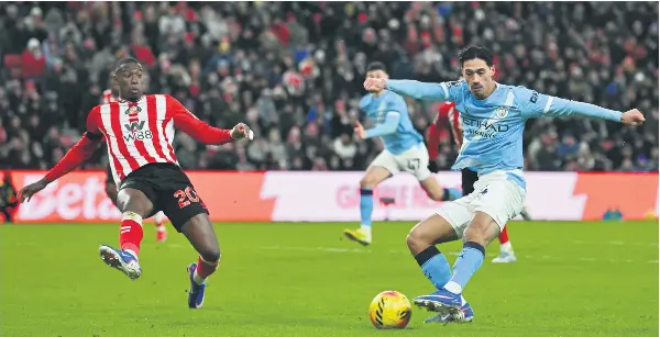  ?? PHOTO: AFP ?? Manchester City defender Tijjani Reijnders (right) shoots but sees the shot saved during the English Premier League football match between Sunderland and Manchester City at The Stadium of Light in Sunderland in north east England on January 1, 2026.