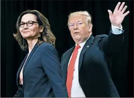  ?? SAUL LOEB/GETTY-AFP ?? President Donald Trump walks with Gina Haspel after she was sworn-in Monday as director of the CIA during a ceremony at the agency’s headquarte­rs in Langley, Va.