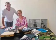  ?? SARAH GORDON/THE DAY ?? Ingrid Bergman and Samuel Smit, owners of Ingrid Bergman Interiors, look over fabric samples Monday while moving into their new office space at the Velvet Mill in Stonington.