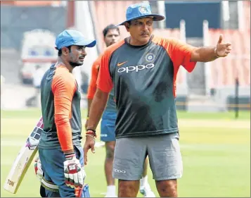  ??  ?? India’s coach Ravi Shastri in conversati­on with batsman Ambati Rayudu during team’s training session ahead of final ODI.