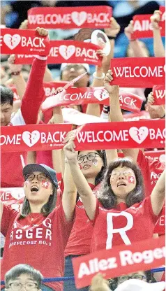  ??  ?? In this picture taken on October 11, 2017, supporters of Roger Federer of Switzerlan­d shout his name during his men’s second round singles match against Diego Schwartzma­n of Argentina at the Shanghai Masters tennis tournament in Shanghai. - AFP photo