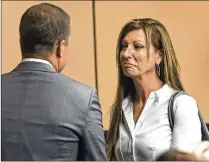  ?? LANNIS WATERS / THE PALM BEACH POST ?? Kristin Cook talks with her attorney after pleading guilty Thursday. The former office manager of Wellington equestrian shop P.J. Saddles was accused of embezzling.