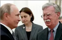  ??  ?? Russian President Putin with John Bolton at the Kremlin in moscow on Tuesday. — AfP