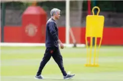 ?? —AP ?? CARRINGTON: Manchester United manager Jose Mourinho attends a training session at the AON Training Complex in Carrington yesterday, ahead of the Europa League Final against Ajax today.