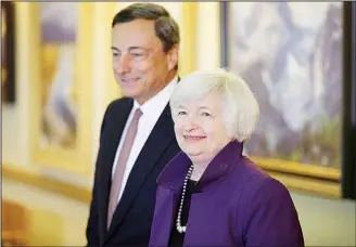  ??  ?? In this file photo, Federal Reserve Chair Janet Yellen (right), and European Central Bank President Mario Draghi walk together during the Jackson Hole Economic Policy Symposium at the Jackson Lake Lodge in Grand Teton National Park near Jackson, Wyo....