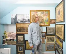  ??  ?? Cameron Smith, of Catasauqua, looks over his collection of borough history while at home.