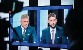  ?? ?? The leader of Smer-SSD, Robert Fico (left) and the Progresívn­e Slovensko leader, Michal Simecka, seen on a TV screen during a televised debate on Wednesday. Photograph: Jakub Gavlák/EPA