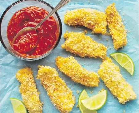  ??  ?? These golden, panko-coated fish sticks and homemade cocktail sauce go well served with coleslaw or a green salad.