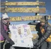  ??  ?? Sharron and Chris Rogers at the top of Mount Kilimanjar­o.