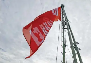  ?? ELAINE THOMPSON — THE ASSOCIATED PRESS ?? The WNBA flag flutters atop the Space Needle after being raised by WNBA All-Star players Friday.