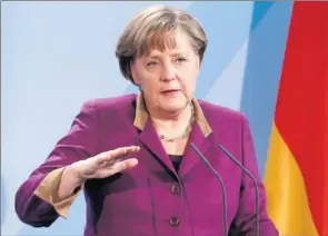  ?? By Michele Tantussi, Bloomberg News ?? Nation under pressure: Chancellor Angela Merkel, speaking Thursday in Berlin, says it doesn’t make sense for Germany to add to the EU bailout funds if the root cause of the debt crisis isn’t addressed.