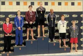  ??  ?? Radnor’s Patrick Cullen (second from right) poses with his medal for finishing fifth in the 50-meter freestyle at the PIAA Class 3A Championsh­ips Wednesday at Bucknell University.