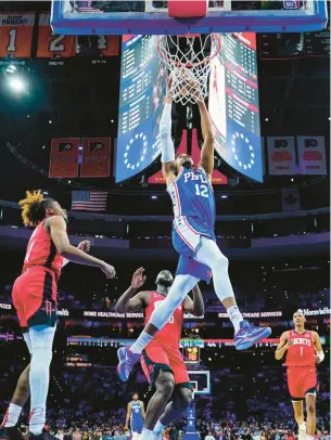  ?? CHRIS SZAGOLA/AP ?? The 76ers’ Tobias Harris dunks against the Houston Rockets during the first half Monday night.