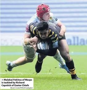  ?? Micah Crook/PPAUK/Gallagher ?? Malakai Fekitoa of Wasps is tackled by Richard Capstick of Exeter Chiefs