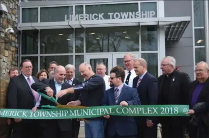  ?? MARIAN DENNIS — DIGITAL FIRST MEDIA ?? Officials stepped outside Saturday to officially cut the ribbon on the new $10 million Limerick Township Building.