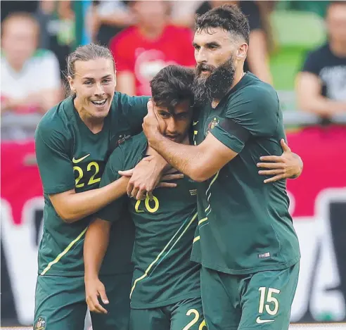  ??  ?? MASS POTENTIAL: Mile Jedinak and Jackson Irvine celebrate Daniel Arzani’s opening goal in Budapest.