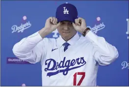  ?? MARCIO JOSE SANCHEZ — THE ASSOCIATED PRESS ?? Shohei Ohtani said Thursday he chose to sign with the Los Angeles Dodgers because of the organizati­on's recent history of making the playoffs.