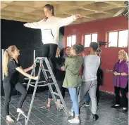  ??  ?? MENTOR FOR MANY: Linda-Louise Swain, right, guides youngsters through a theatre workshop