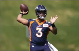  ?? DAVID ZALUBOWSKI — THE ASSOCIATED PRESS, FILE ?? Quarterbac­k Russell Wilson takes part in drills at the Broncos' voluntary minicamp on April 27at the team's headquarte­rs in Englewood, Colo.