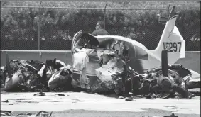  ?? WALLY SKALIJ/LOS ANGELES TIMES ?? A small plane sits on the Interstate 405 southbound freeway after a crash just short of the John Wayne Aiport runway on Friday in Newport Beach.