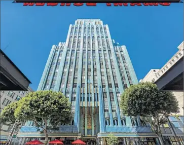  ?? Ricardo Dearatanha Los Angeles Times ?? THE EASTERN COLUMBIA BUILDING towers over Broadway. Analysts say downtown L. A. reminds investors of New York neighborho­ods before redevelopm­ent swept through Manhattan into the other boroughs.