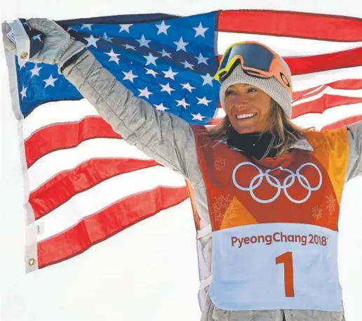  ?? Hyoung Chang, The Denver Post ?? Jamie Anderson of South Lake Tahoe, Calif., celebrates Monday after winning the gold medal in women’s slopestyle snowboardi­ng in Bongpyeong, South Korea. Anderson won the same event four years ago at the Sochi Olympics, the first time it was held.