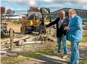  ?? ?? Taupō mayor David Trewavas, left, and Tū wharetoa’s Rakeipoho Taiaroa at the building site on Horomatang­i St; right, an artist’s impression of the new building.