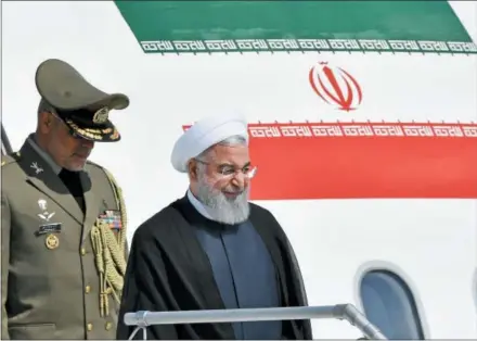  ?? KEYSTONE — WALTER BIERI ?? Iranian President Hassan Rouhani arrives Monday at the Zurich airport in Kloten, Switzerlan­d. Hassan Rouhani is on a two-day state visit to Switzerlan­d.