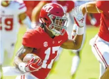  ?? AP PHOTO/BUTCH DILL ?? Alabama freshman receiver Jaylen Waddle had two touchdown catches and a 63-yard punt return for a score in Saturday’s 56-14 dismantlin­g of Louisiana.