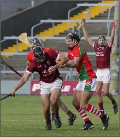 ??  ?? Leonard Connolly of Rapparees puts Mark Maloney of St Martin’s under pressure during the Pettitt’s SHC in Wexford Park.