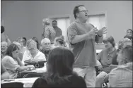  ?? TIMES photograph by Annette Beard ?? With the largest crowd in attendance at a Town Hall meeting, several residents of Sugar Creek Road said they had been promised their road would be paved during the Benton County Town Hall meeting in Garfield Aug. 21.