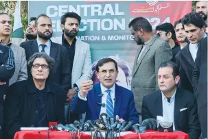  ?? (Ariba Shahid/Reuters) ?? GOHAR ALI KHAN, chairman of former prime minister Imran Khan’s Pakistan Tehreek-Insaf Party, calls on ‘all institutio­ns’ in the country to respect the PTI’s mandate at a press conference at the party’s office in Islamabad yesterday.