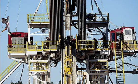  ?? AFP ?? A fracking rig in the Permian Basin oil field in Texas. The IEA estimates nonOPEC supply growth will surge to 2.3 million barrels per day next year.