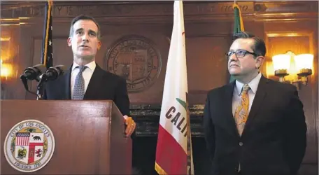  ?? Francine Orr Los Angeles Times ?? LOS ANGELES City Administra­tive Officer Miguel Santana, right, at a budget news conference with Mayor Eric Garcetti in April.