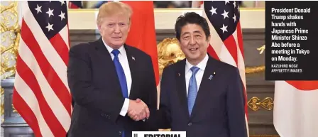  ?? KAZUHIRO NOGI/ AFP/ GETTY IMAGES ?? President Donald Trump shakes hands with Japanese Prime Minister Shinzo Abe before a meeting in Tokyo on Monday.