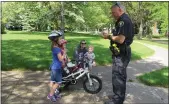  ?? MENTOR POLICE DEPARTMENT FACEBOOK PAGE ?? Mentor police have a long tradition of rewarding children who wear bicycle helmets.