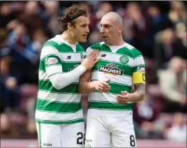  ??  ?? Erik Sviatchenk­o shares a word with Celtic captain Scott Brown