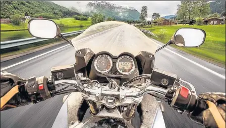  ??  ?? A biker on the road