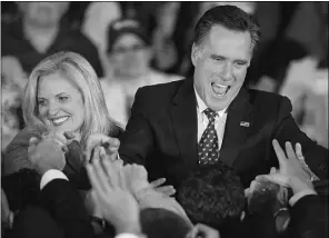  ?? PAUL J. RICHARDS, AFP/GETY Image
s ?? Florida Republican primary winner Mitt Romney and his wife Ann celebrate
with supporters Tuesday at election-night headquarte­rs in Tampa, Fla.