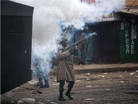  ?? AP ?? Riot police were on the streets of Nairobi as tensions surroundin­g the presidenti­al vote increased and sporadic protests broke out across the capital