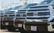  ?? — Reuters ?? Toyota trucks are shown for sale at a car dealership shop in Carlsbad, California.