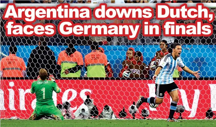  ??  ?? Argentina's Maxi Rodriguez celebrates after scoring the winning kick during a shootout at the end of the World Cup semifinal soccer match between the Netherland­s and Argentina at the Itaquerao Stadium in Sao Paulo Brazil. Argentina won 4-2 on penalties...