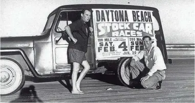  ??  ?? Bill France Sr. kneels beside a promotiona­l vehicle in
1950. Daytona Beach is hosting double milestone celebratio­ns this weekend. NASCAR turns 70, and the Daytona
500 will be
60.
DAYTONA RACING ARCHIVES