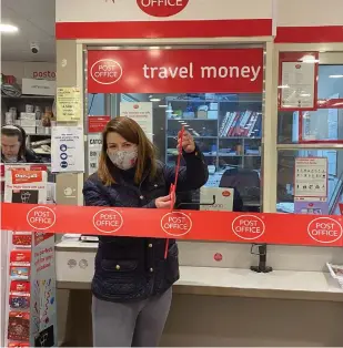  ??  ?? Burnham Conservati­ve MP Joy Morrissey cuts the ribbon at the village's new Post Office and Budgens store on December 11.